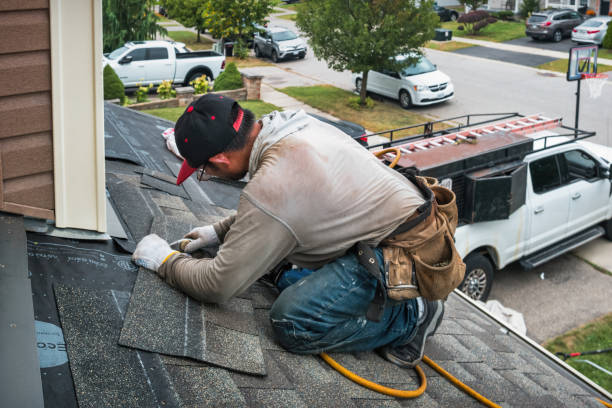 Professional Gutter Repair And Installation technician working in Spring Mount, PA